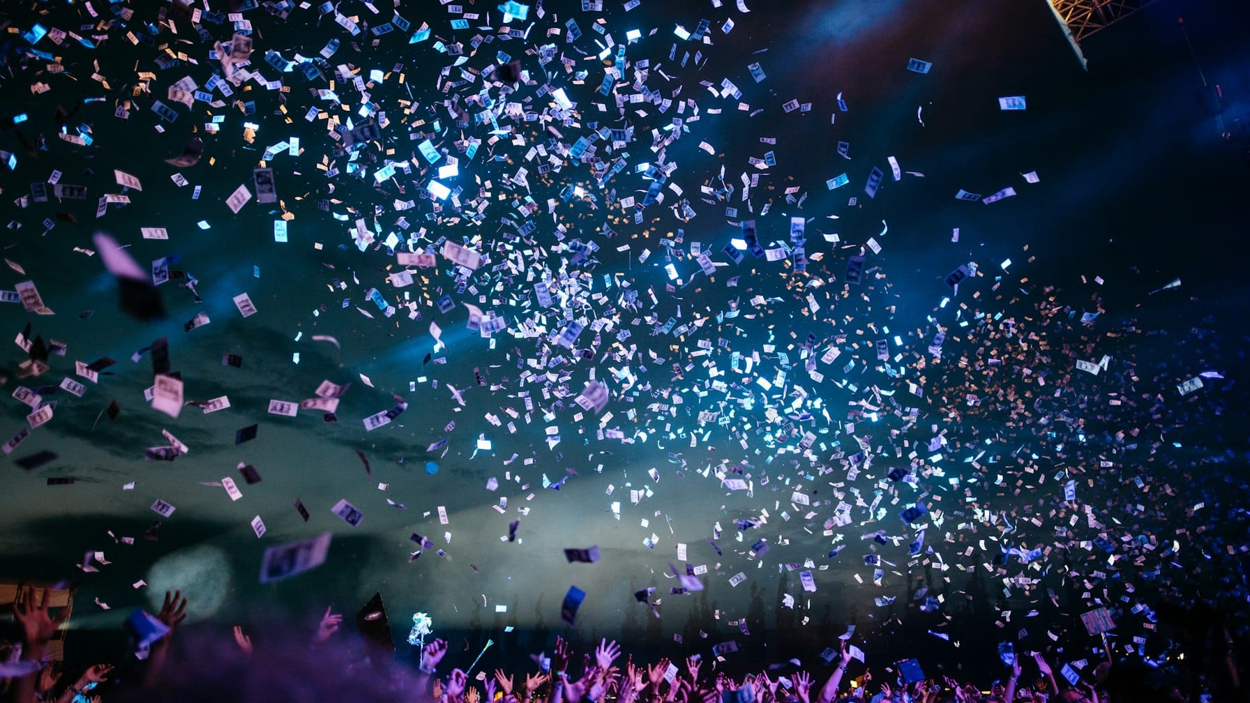 Festival lights and crowd at an evening outdoor event